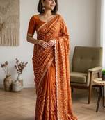 Embellished sequinned heavy work leheriya saree