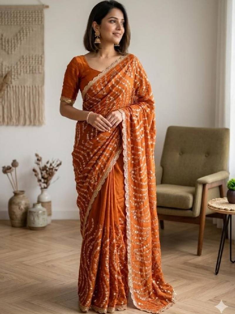 Embellished sequinned heavy work leheriya saree