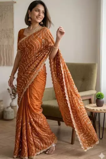Embellished sequinned heavy work leheriya saree