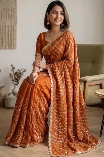 Embellished sequinned heavy work leheriya saree