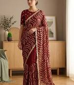 Embellished sequinned heavy work leheriya saree