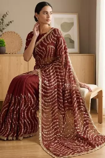 Embellished sequinned heavy work leheriya saree