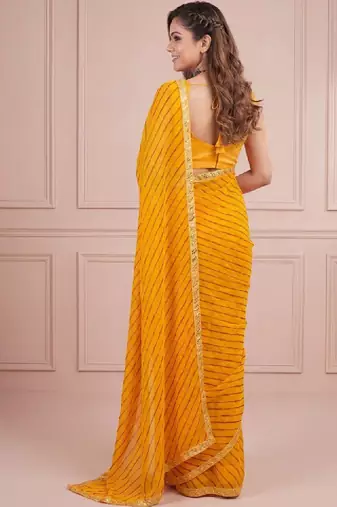 Yellow sequinned leheriya saree with unstiched blouse