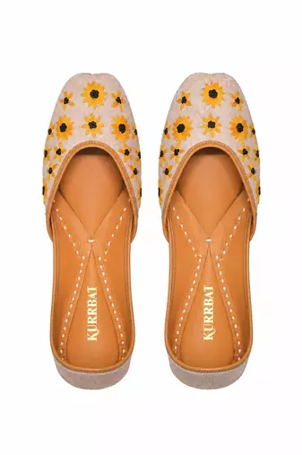 Beige embroidered sunflower motifs jutti