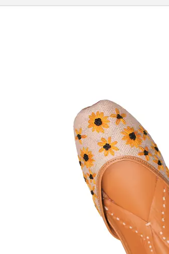 Beige embroidered sunflower motifs jutti