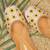 Beige embroidered sunflower motifs jutti