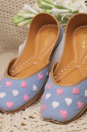Blue denim juttis with white and pink thread embroidery