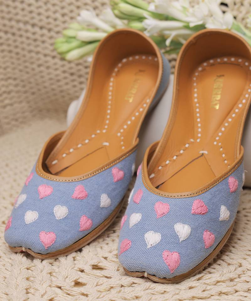 Blue denim juttis with white and pink thread embroidery