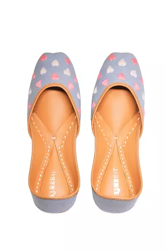 Blue denim juttis with white and pink thread embroidery
