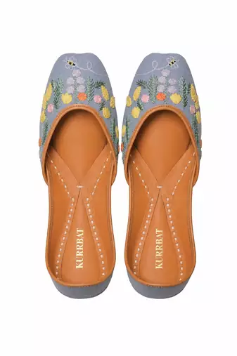 Blue denim juttis with quirk of floral embroidery