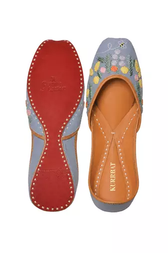 Blue denim juttis with quirk of floral embroidery