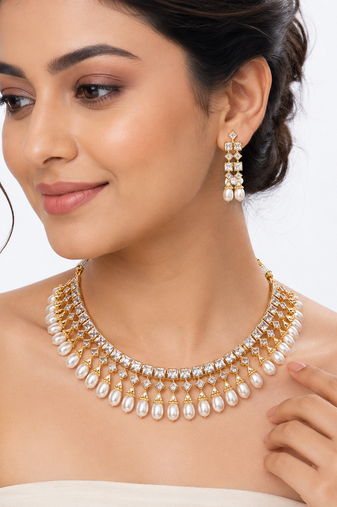 Certified natural freshwater pearls jewellery gold-toned kundan choker necklace and earrings set with pearl drops.