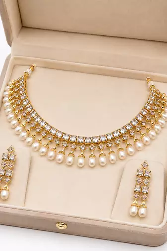 Certified natural freshwater pearls jewellery gold-toned kundan choker necklace and earrings set with pearl drops.