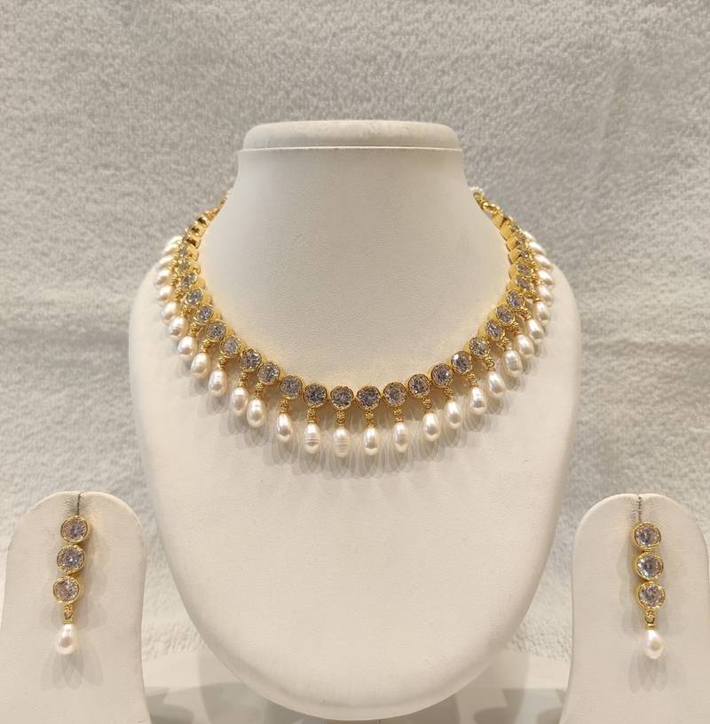 Certified natural freshwater pearls jewellery gold-tone finish, dangling pearl drops, matching earrings, bridal wear.