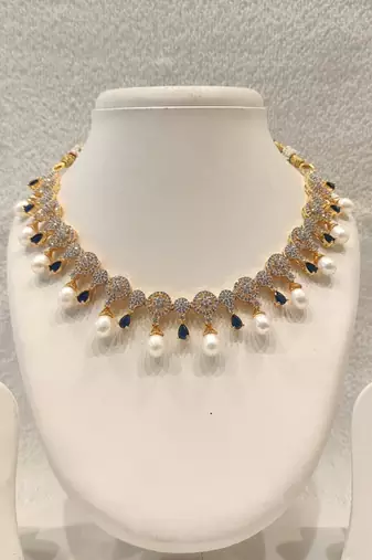 Certified natural freshwater pearls jewellery circular cz motifs, pearl drop danglers, sapphire blue accents, bridal set