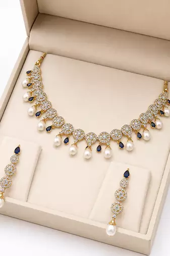 Certified natural freshwater pearls jewellery circular cz motifs, pearl drop danglers, sapphire blue accents, bridal set