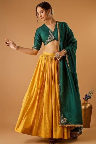 Green embroidered blouse with yellow flared lehenga with embroidered dupatta