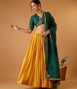 Green embroidered blouse with yellow flared lehenga with embroidered dupatta