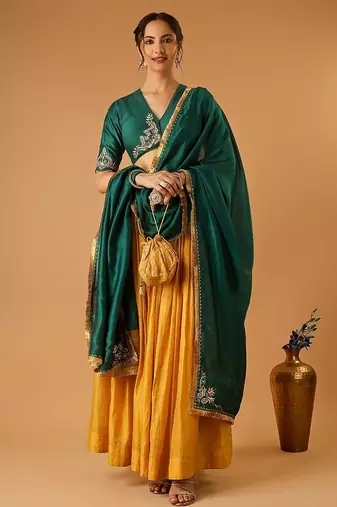 Green embroidered blouse with yellow flared lehenga with embroidered dupatta