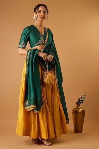 Green embroidered blouse with yellow flared lehenga with embroidered dupatta