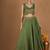 Olive green chanderi layered skirt set with hot pink katan silk dupatta