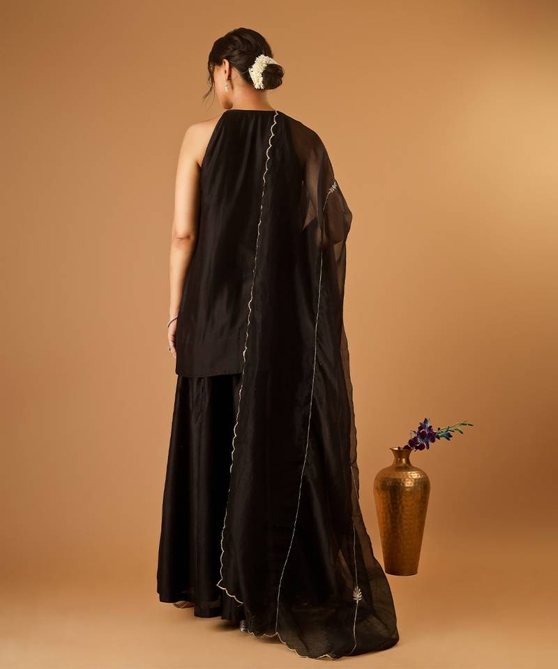 Sleeveless chanderi short kurti and sharara with embroidered katan dupatta in black