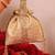 Gold silk woven potli bag