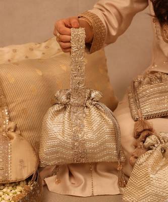 Gold silk woven potli bag 2