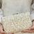 Beige tissue suede clutch