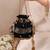 Black semi tissue potli bag
