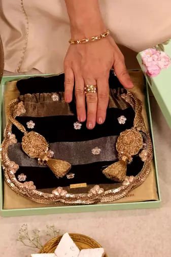 Black semi tissue potli bag