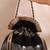 Black semi tissue potli bag