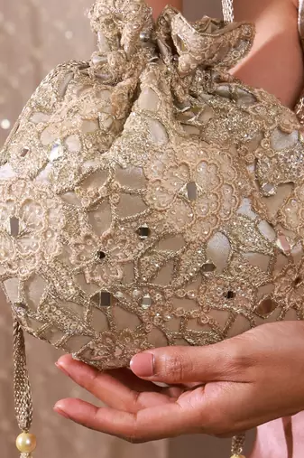 Gold tissue cutwork mirror synthetic potli bag