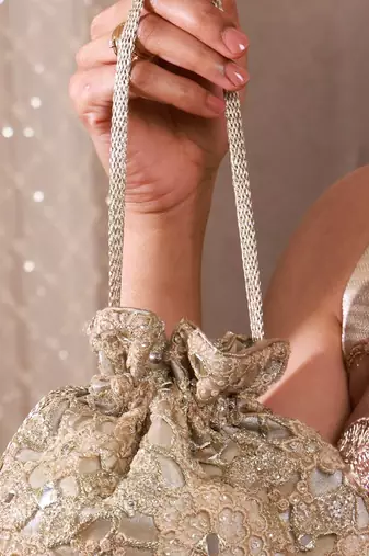 Gold tissue cutwork mirror synthetic potli bag