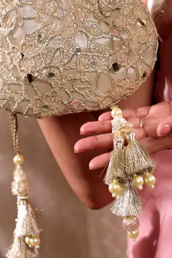 Gold tissue cutwork mirror synthetic potli bag