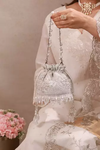 Silver hand embroidered silk potli bag