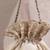 Beige woven silk satin potli bag