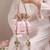 Peach pink woven silk satin potli bag