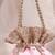 Peach pink woven silk satin potli bag