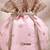 Peach pink woven silk satin potli bag