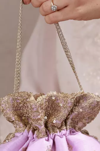 Lilac woven silk satin potli bag