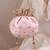 Peach pink woven silk satin potli bag