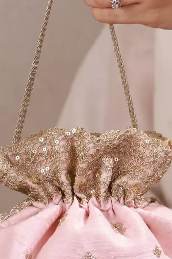 Peach pink woven silk satin potli bag