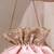 Peach pink woven silk satin potli bag