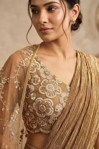 Gold embroidered textured shimmer saree set with jacket