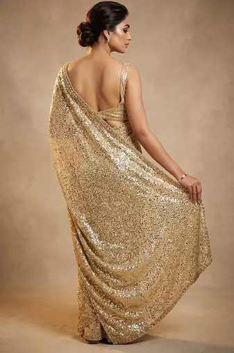 Gold embroidered georgette saree with unstitched blouse