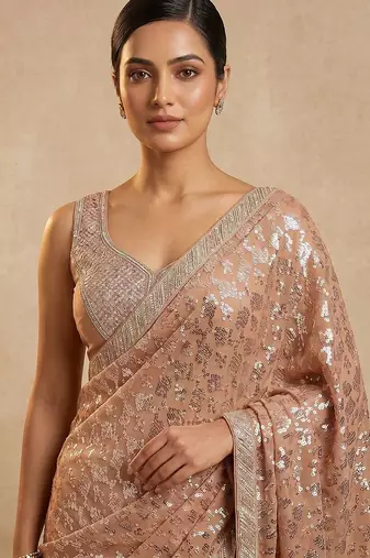 Peach embroidered georgette saree with unstitched blouse
