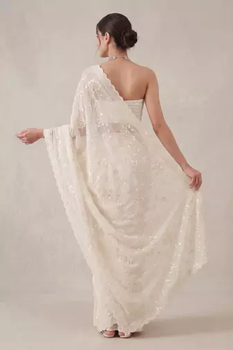 White embroidered georgette saree with unstitched blouse