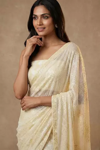 Yellow embroidered georgette saree with unstitched blouse