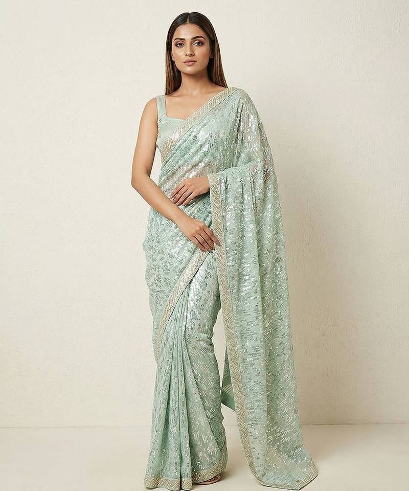 Green embroidered georgette saree with unstitched blouse